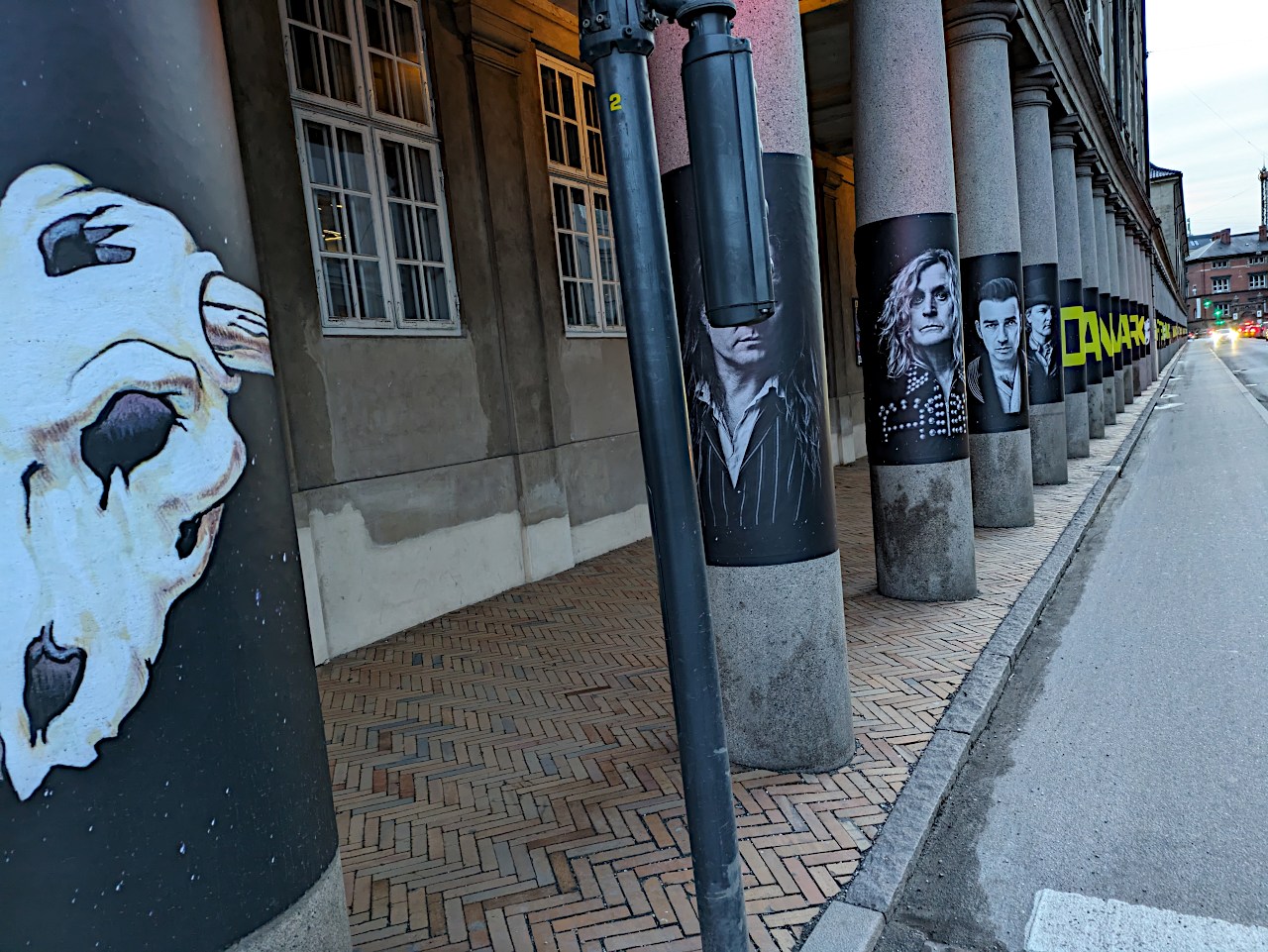Columns outside the Danish National Museum decorated with pictures of the band D-A-D, other angle